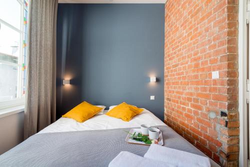 Postel nebo postele na pokoji v ubytování Sopot Loft