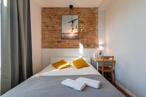 Postel nebo postele na pokoji v ubytování Sopot Loft