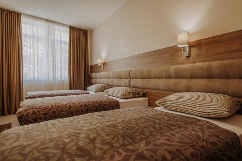 Postel nebo postele na pokoji v ubytování Villa Martini - apartments & rooms