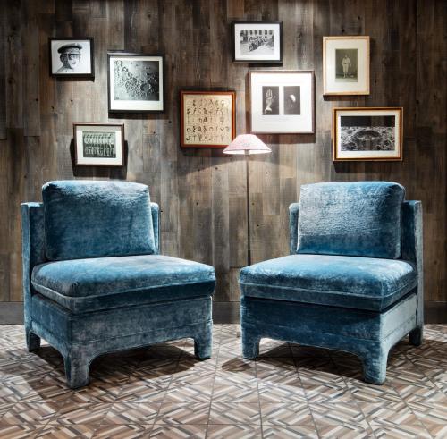 a pair of chairs and a stool in a room at Graduate by Hilton State College in State College