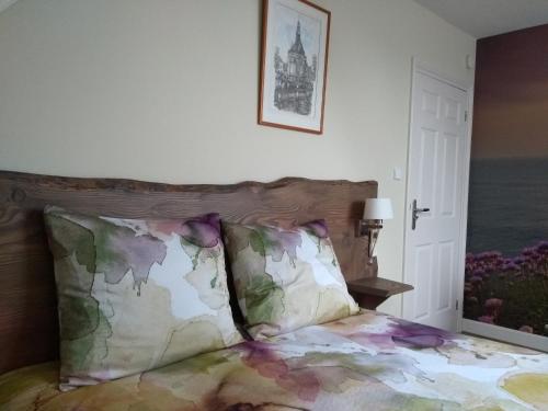 Tempat tidur dalam kamar di Bed & Breakfast Ons Nest