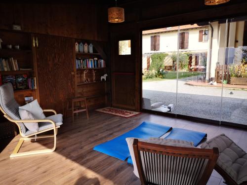 a living room with a large window and a couch at Agriturismo Ca' di Mazza in Monzuno