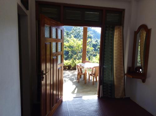 an open door to a dining room with a table at Nature's Rest in Ella