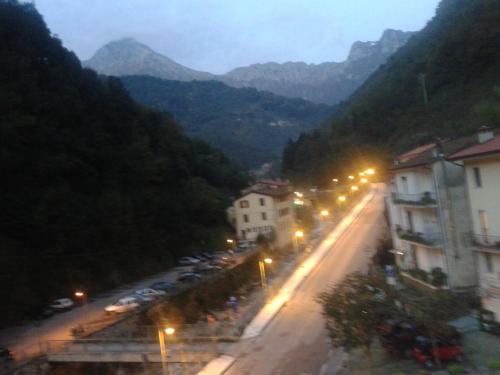 a city street with buildings and street lights at night at La Pania in Stazzema