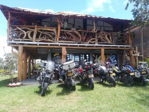 a group of motorcycles parked in front of a building at Cabañas Guacari San Agustín huila in San Agustín