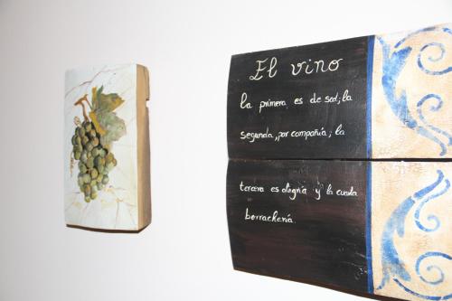a book with a picture of a bunch of grapes at Casa Rural La Torre De Babel in Molinaseca
