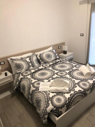 Ένα ή περισσότερα κρεβάτια σε δωμάτιο στο Albergo Aduepassi & Servizio Bike Shuttle
