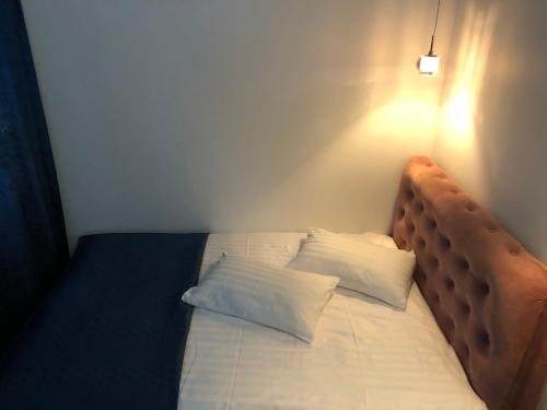 Säng eller sängar i ett rum på Modern and Luxury Apartment in the Center of Kaunas