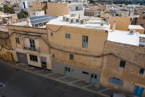 an aerial view of a city with buildings at Talbot & Bons Bed & Breakfast in Gudja