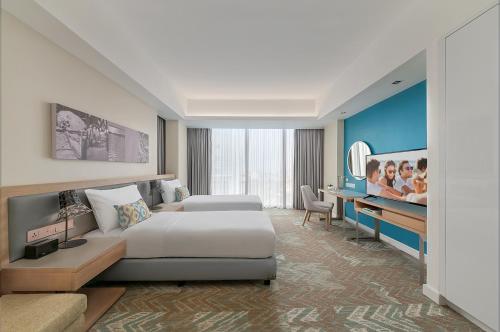 Postel nebo postele na pokoji v ubytování Citadines Cebu City