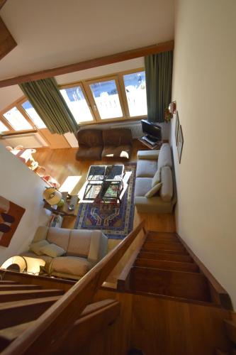 an overhead view of a living room with a couch at EMERALD CENTRALE in Madonna di Campiglio