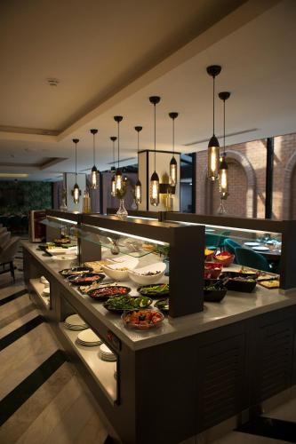 a buffet line with many plates of food at Emens hotel in Izmir