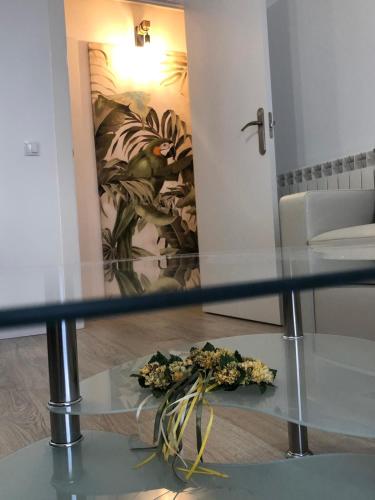 a glass table with a bunch of flowers on it at Casa Palacio Polentinos VUT-AV390 in Ávila