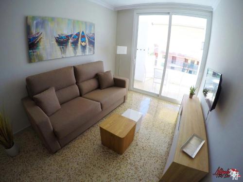 a living room with a couch and a coffee table at Edificio Abora in Los Cristianos