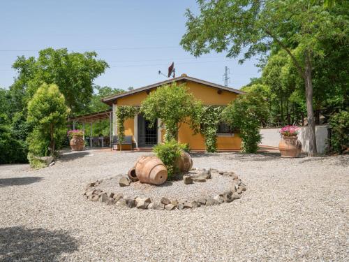 a house with a bird perched on top of it at Holiday Home Villa Lavinia by Interhome in Montevarchi
