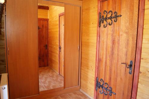 a bathroom with a shower and a glass door at Норіс in Migovo