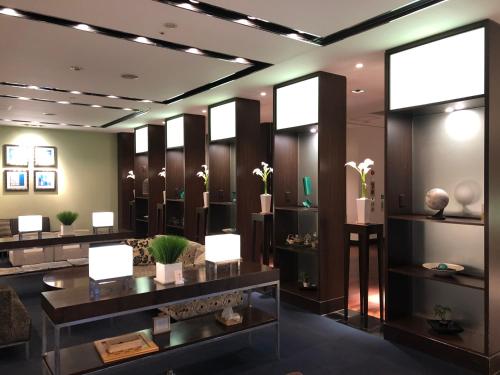 a lobby with plants on display in a building at Hotel IL Cuore Namba in Osaka