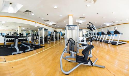 a gym with cardio machines and treadmills at City Seasons Hotel & Suites Muscat in Muscat