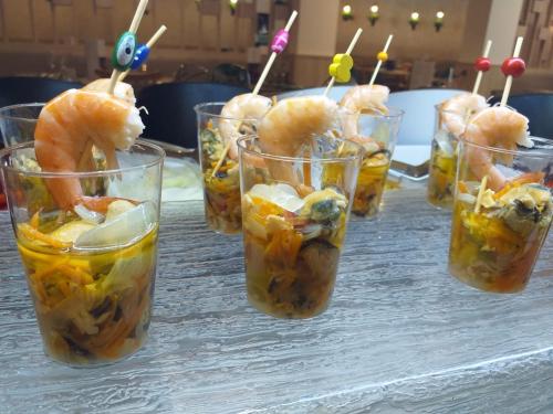 a group of glasses of food with shrimp and fruit at Gara Suites Golf & Spa in Playa de las Americas