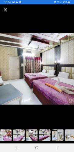 a room with two beds and avertisement at Hotel Shehnaz Inn - Walking Distance for Golden Temple in Amritsar