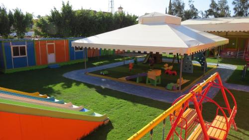 an aerial view of a playground with a slide at Africana Hotel & Spa in Borg El Arab
