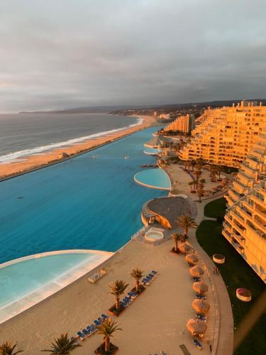 an aerial view of a beach with buildings and the ocean at Condominio San Alfonso Del Mar - Vista Inmejorable in Algarrobo