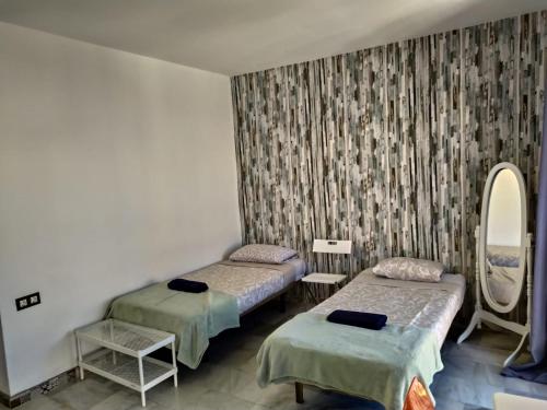 Cama o camas de una habitación en Málaga Centro Hostel