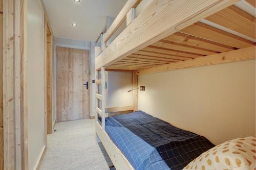 a bedroom with a bunk bed in a room at SCHUSS B4 in Morzine