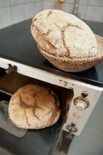 two loaves of bread sitting on top of an oven at Weingut Schauer in Kitzeck im Sausal