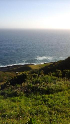 a view of the ocean from the top of a hill at Anglers Paradise in Eersterivierstrand