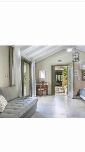 a living room with a couch and a table at Fanari House in Argostoli