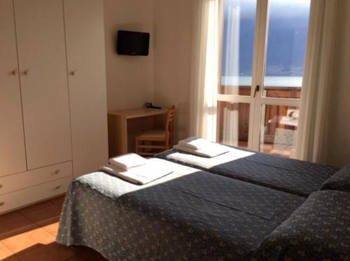 Postel nebo postele na pokoji v ubytování Hotel Castell - Montagnoli Group