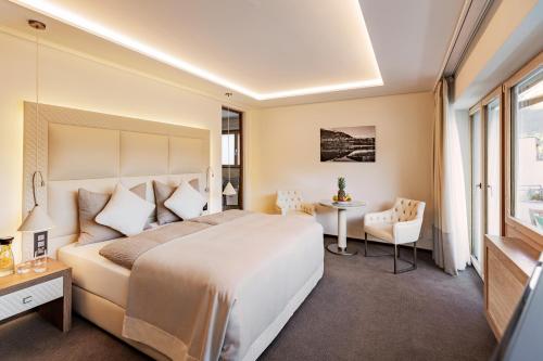 Un pat sau paturi într-o cameră la Hotel Arte