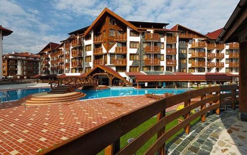 a large apartment building with a pool and a resort at Apartment in Belvedere Holiday Club 550 m from ski lift in Bansko