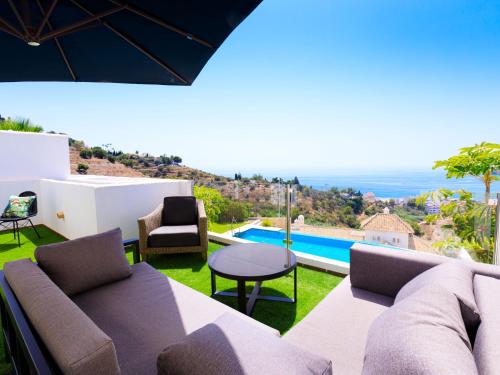 a living room with a couch and a table at Holiday Home Creativo by Interhome in La Herradura