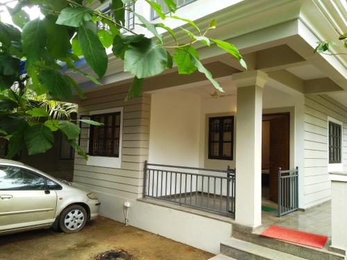 a car parked in front of a house at DSK Studio Apartment, Siolim, Goa. in Siolim
