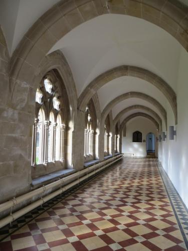 an aisle in a castle with a checkered floor at Glenwood Apartment at The Highland Club in Fort Augustus