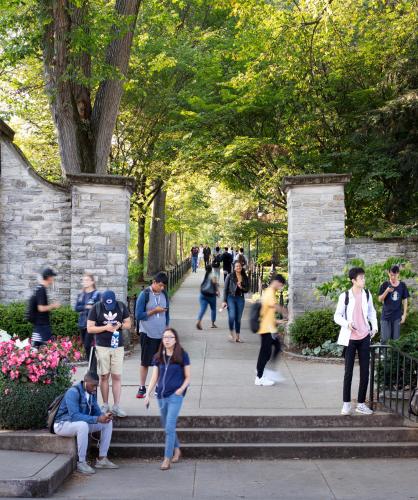 a group of people walking in a park at Graduate by Hilton State College in State College