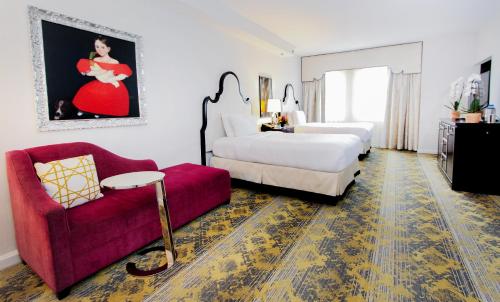 Ένα ή περισσότερα κρεβάτια σε δωμάτιο στο The Churchill Hotel Near Embassy Row