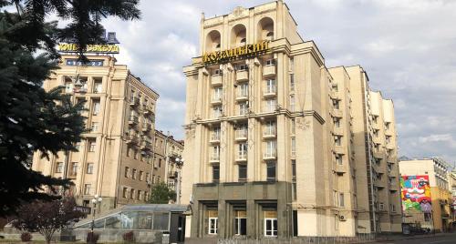 a large building with a clock tower on top of it at Kozatskiy Hotel in Kyiv