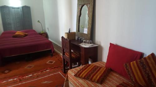 Una cama o camas en una habitación de Riad Medina