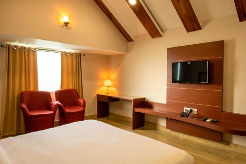 TV a/nebo společenská místnost v ubytování Riddhi Siddhi Resorts
