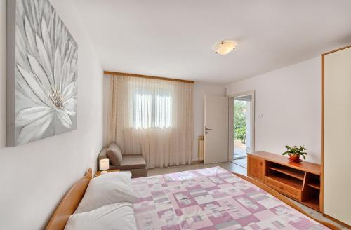 Postel nebo postele na pokoji v ubytování Apartmani MARINA