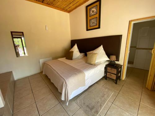 a bedroom with a large bed in a room at Lanseria Country Estate in Lanseria