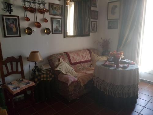 a living room with a couch and a table at Apartamento de Lujo en Puente del Rey El Rocio in El Rocío