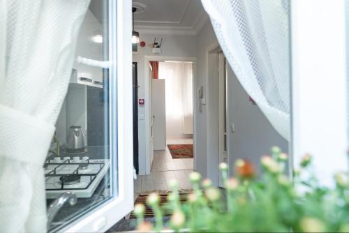 a kitchen with a stove and a view of a hallway at Dualis Hotel in Istanbul