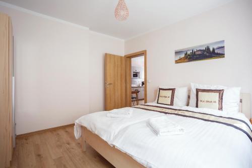 Ένα ή περισσότερα κρεβάτια σε δωμάτιο στο Diana Apartments Karlovy Vary