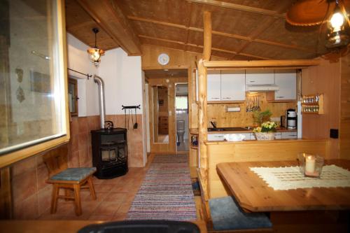 a kitchen with a table and a stove at Ferienhaus Stupp in Gries im Sellrain