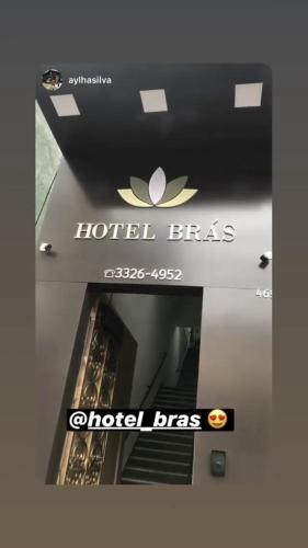 a sign that says hotel fees and a hotel boss at Hotel Brás in Sao Paulo
