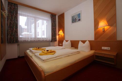 Postel nebo postele na pokoji v ubytování Lärchenheim Apartments